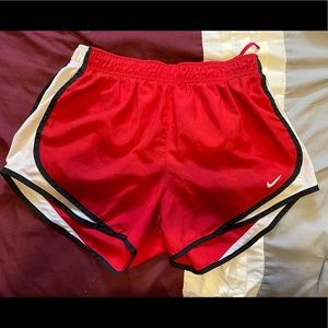 Red and white Nike athletic shorts